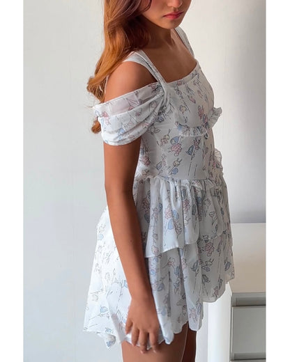 Dreamy & delicate floral dress with ruffles and an asymmetrical hem