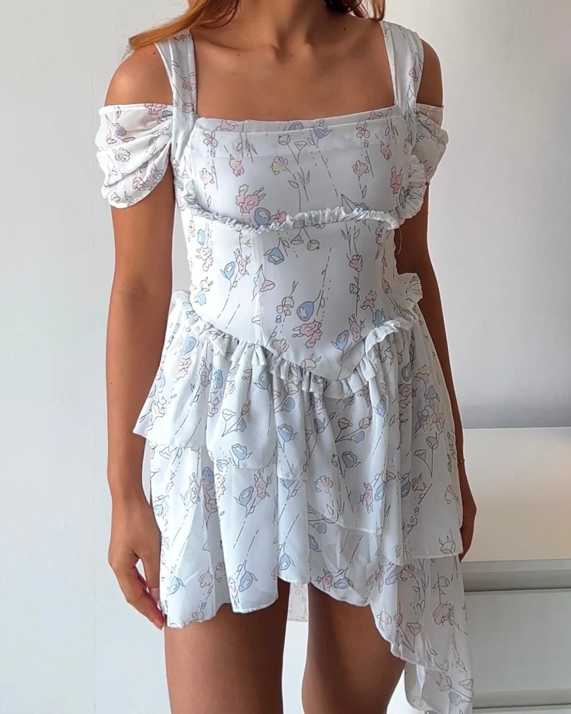 Dreamy & delicate floral dress with ruffles and an asymmetrical hem