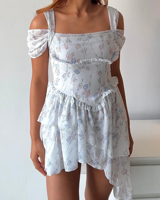Dreamy & delicate floral dress with ruffles and an asymmetrical hem
