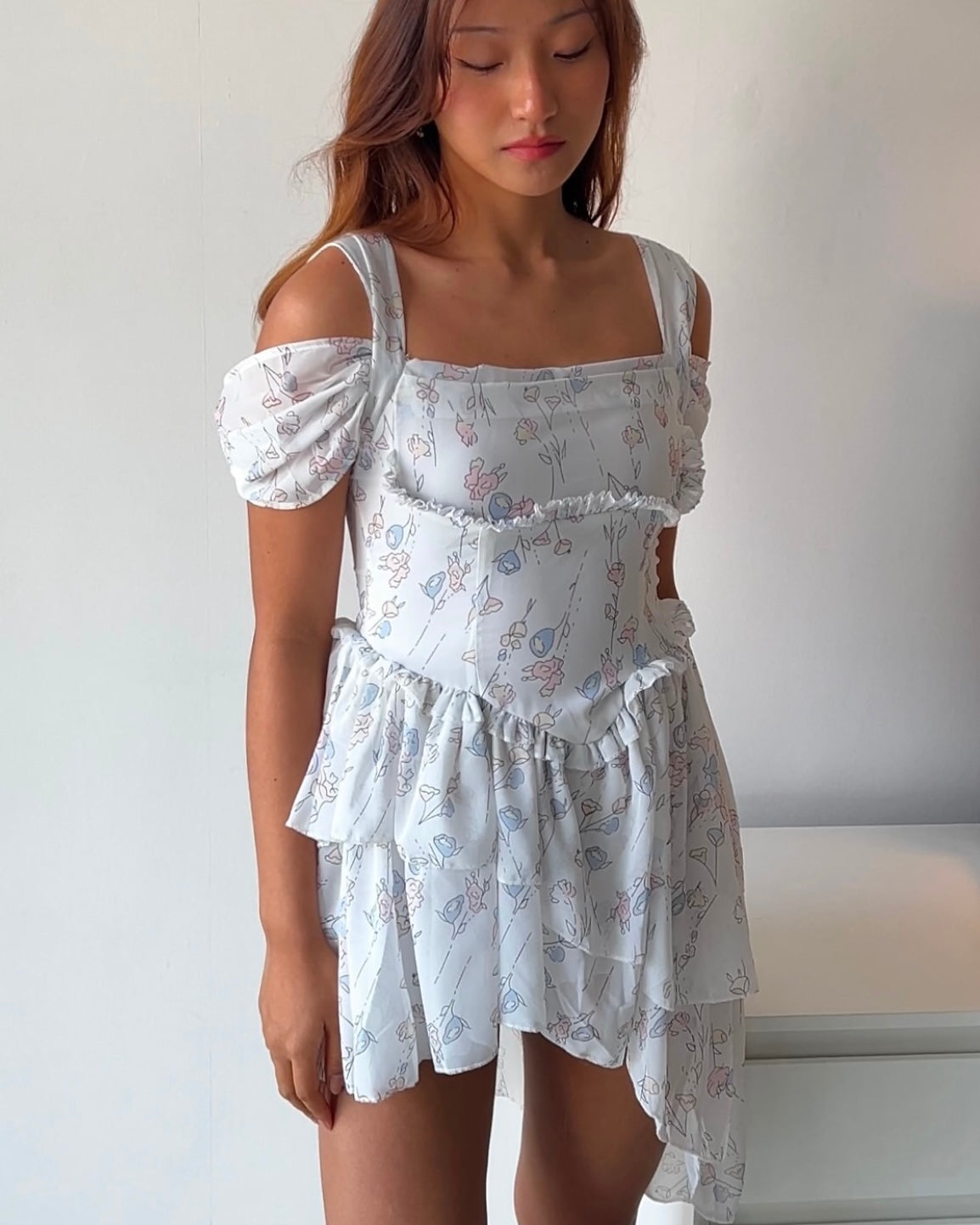 Dreamy & delicate floral dress with ruffles and an asymmetrical hem