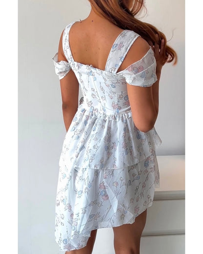 Dreamy & delicate floral dress with ruffles and an asymmetrical hem