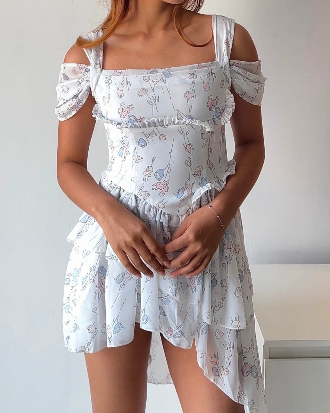 Dreamy & delicate floral dress with ruffles and an asymmetrical hem