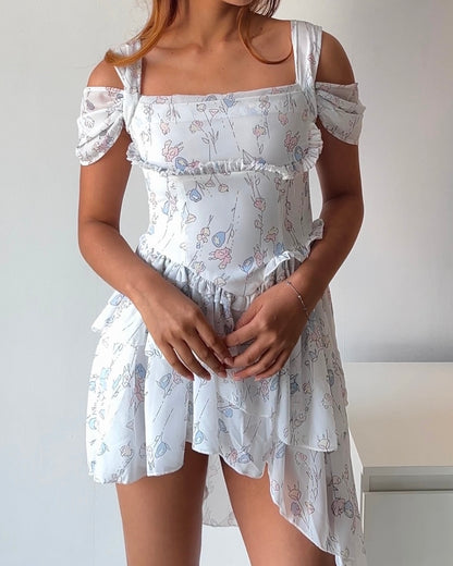 Dreamy & delicate floral dress with ruffles and an asymmetrical hem