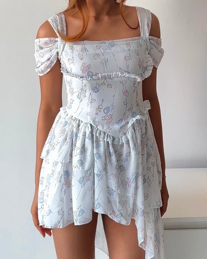 Dreamy & delicate floral dress with ruffles and an asymmetrical hem
