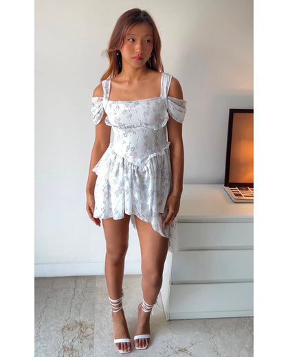 Dreamy & delicate floral dress with ruffles and an asymmetrical hem