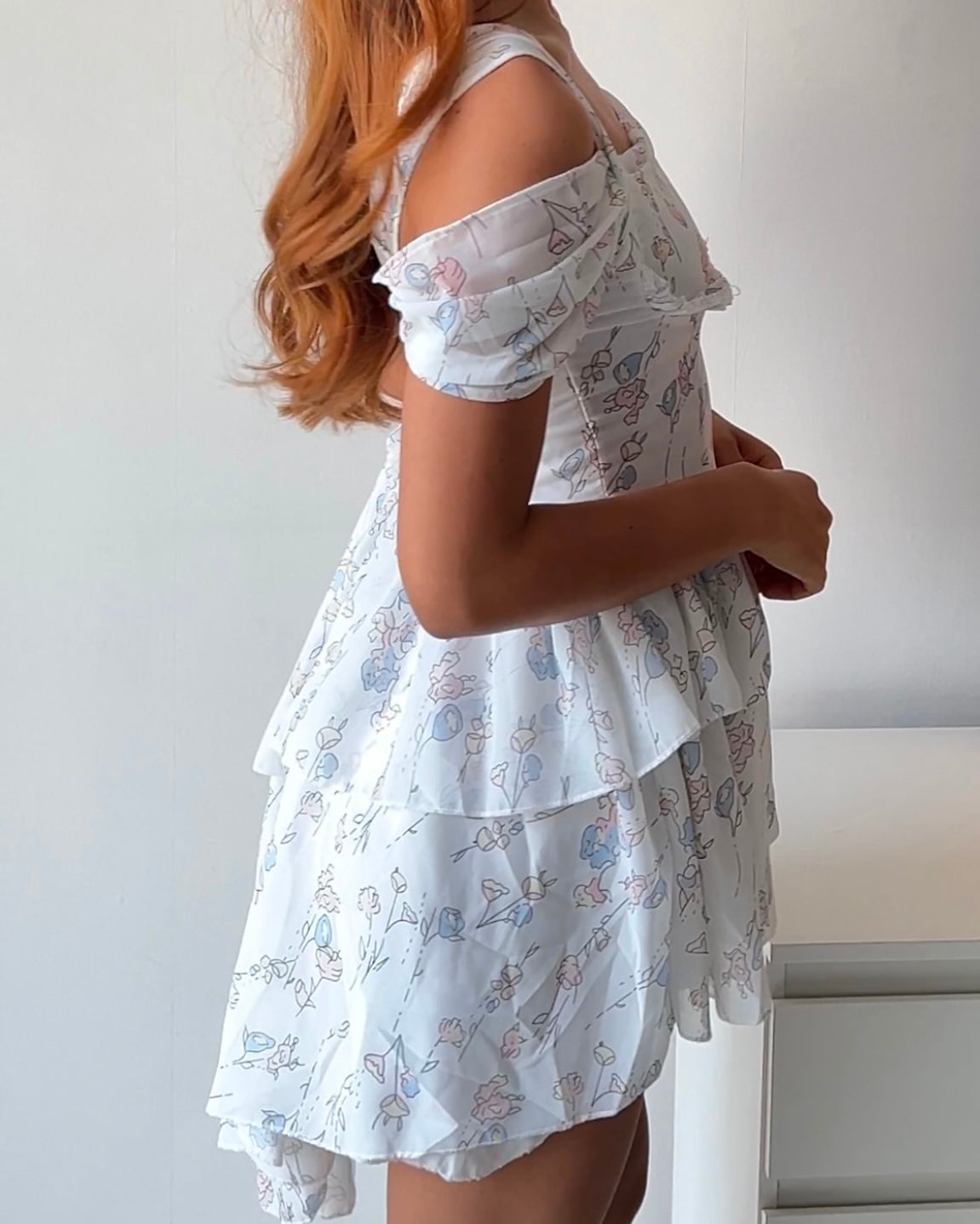 Dreamy & delicate floral dress with ruffles and an asymmetrical hem