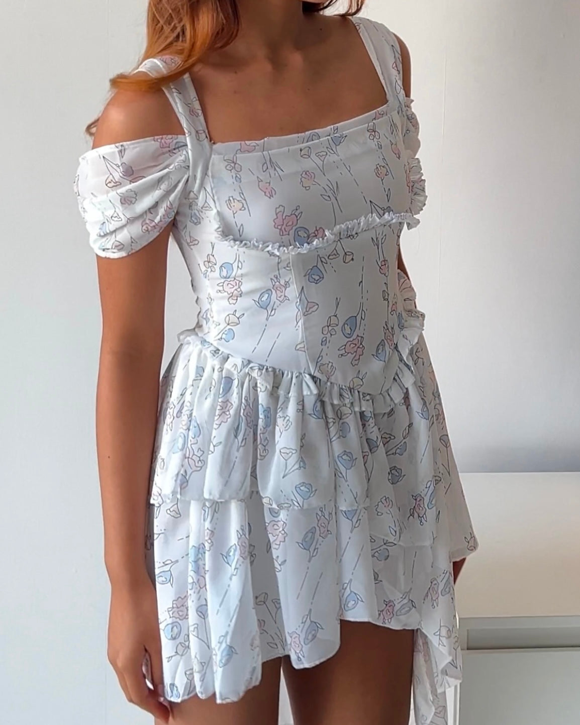 Dreamy & delicate floral dress with ruffles and an asymmetrical hem