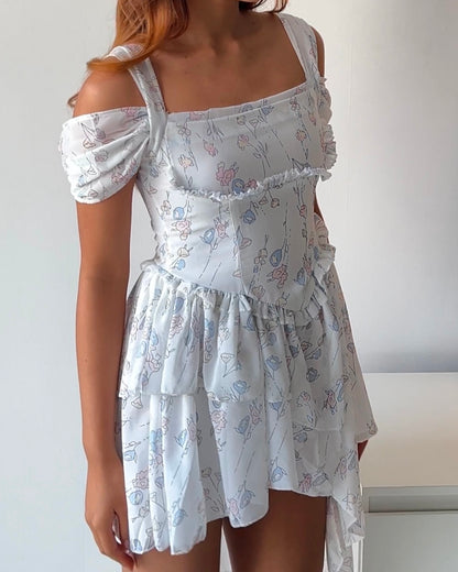 Dreamy & delicate floral dress with ruffles and an asymmetrical hem